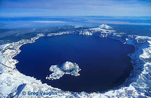 Aerial view of Crater Lake and Wizard Island with winter snow.