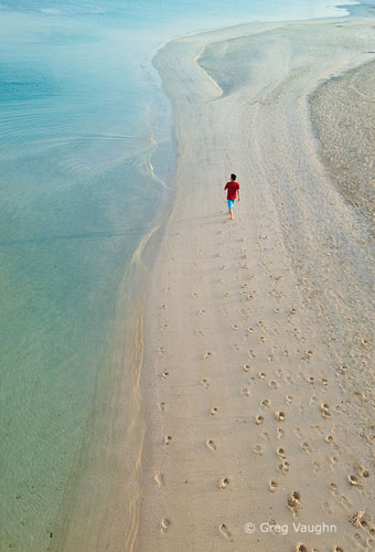 man walking on beach in Dubai
